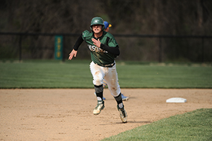 Senior Kevin Kopas sprints to home plate during the Mustang's game against Widener College. (Photo by Sabina Moran)