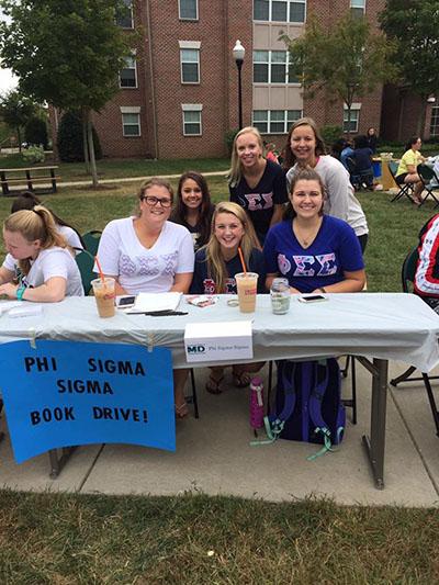 Phi Sigma Sigma hosting a book drive at this years Mustangs Make a Difference Day (Photo from Megan Kotrla)