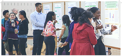 Students presenting the posters of their internship.
(Photo from SU Now Portal)