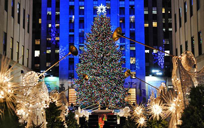 The tree at Rockefeller Center is a popular destination for visitors during the holiday season.  (Photo from newyork.com)