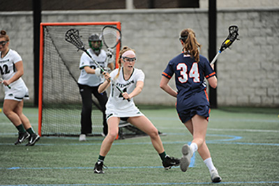 Stevenson freshman Carly Bowes defends a Gettysburg player in the 16-6 loss. (Photo by Sabina Moran)