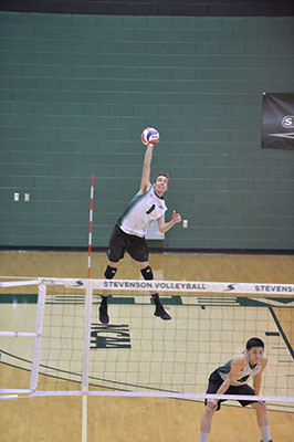 Landon Shorts delivers a serve during a win over #3 Marymount University. (Photo taken by Sabina Moran)