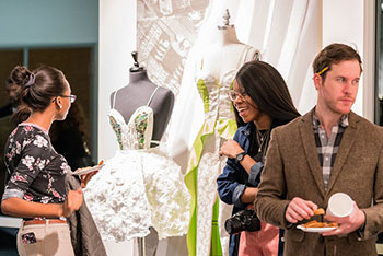 Students enjoy the designs that will be showcased at the fashion show. Photo from Stevenson Flickr.