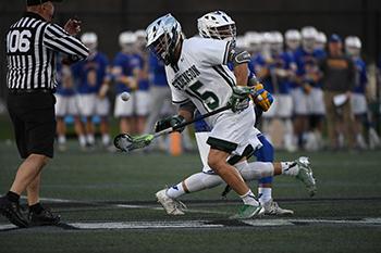 Sophomore Justin Burnette  wins a face off in the Mustangs 11-10 win over Widener on April 27. (Photo by Sabina Moran) 