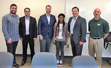 Kayla Bias receiving the 2018 Maryland CIO Roundtable scholarship in the Brown School of Business and Leadership at Stevenson University. (Photo from stevenson.edu)