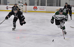 Trinity Barcless skates past a Manhattanville player in the Mustangs' game on Nov. 2. (Photo by Sabina Moran)