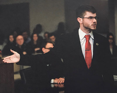 Senior legal studies major, Norman Greenwell performing in a trail.