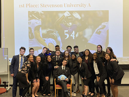 The mock trial teams pose after the A-teams first place victory at the Johns Hopkins Invitational. (Photo from Melanie Snyder)