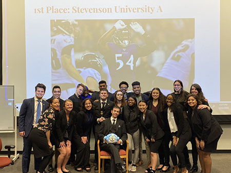 The mock trial teams pose after the A-team's first place victory at the Johns Hopkins Invitational. (Photo from Melanie Snyder)