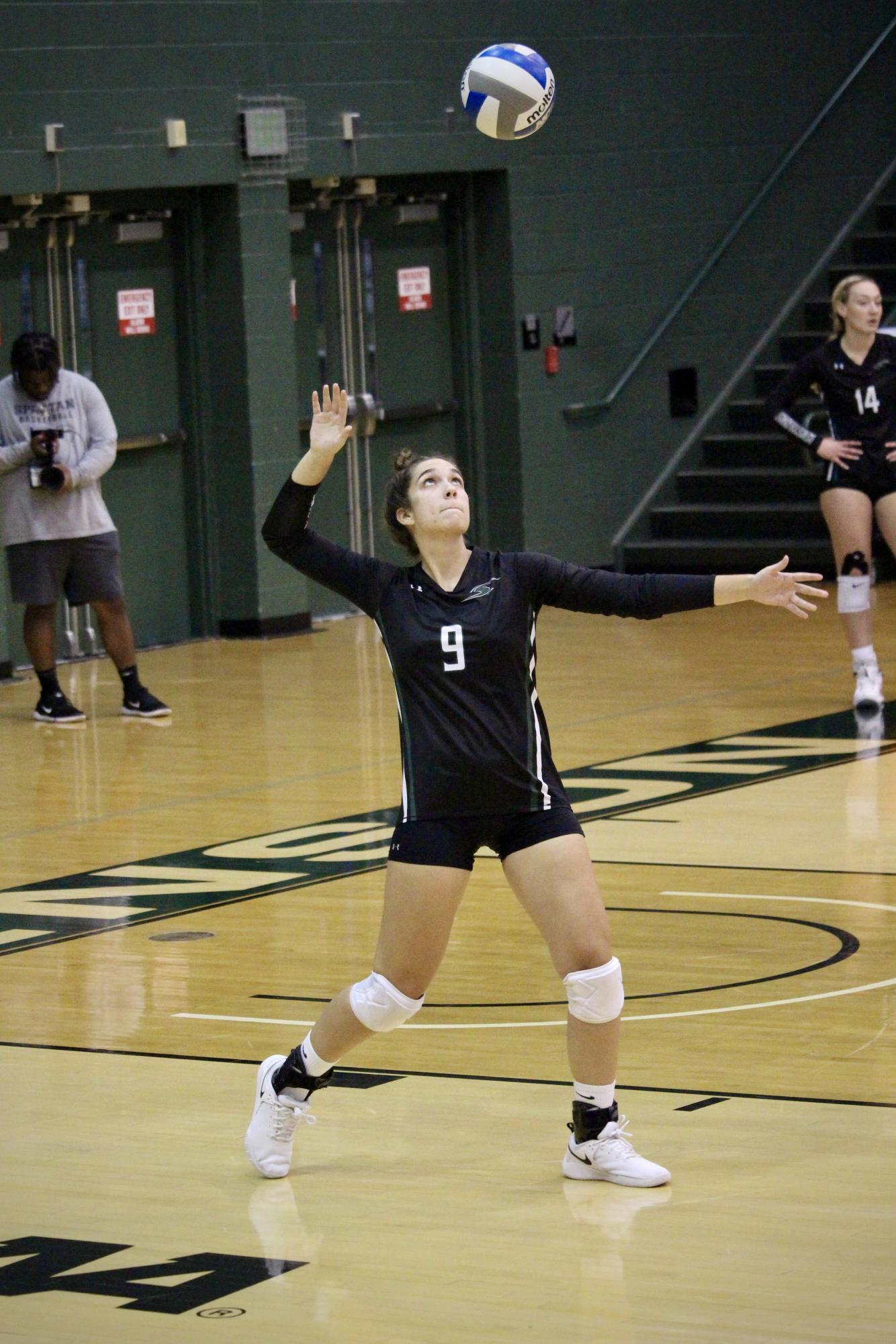Junior setter Makala Thompson serving in a match earlier this month against Albright.