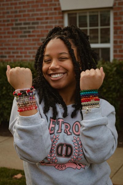 Sophomore business administration major August Jackson shows off her beads.