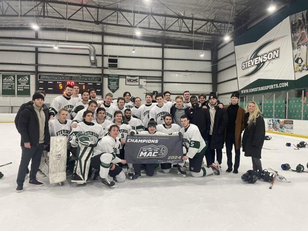 Mens ice hockey poses after capturing second consecutive MAC title.