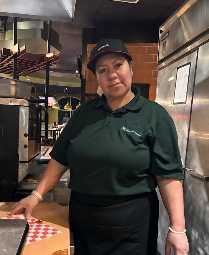 Maria Merchan greets students with a smiling face daily during evening shifts at Pandinis