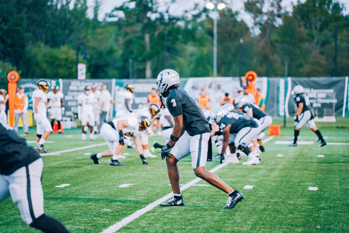 Sophomore wide receiver Deion Richardson lines up before starting an offensive drive for the Mustangs