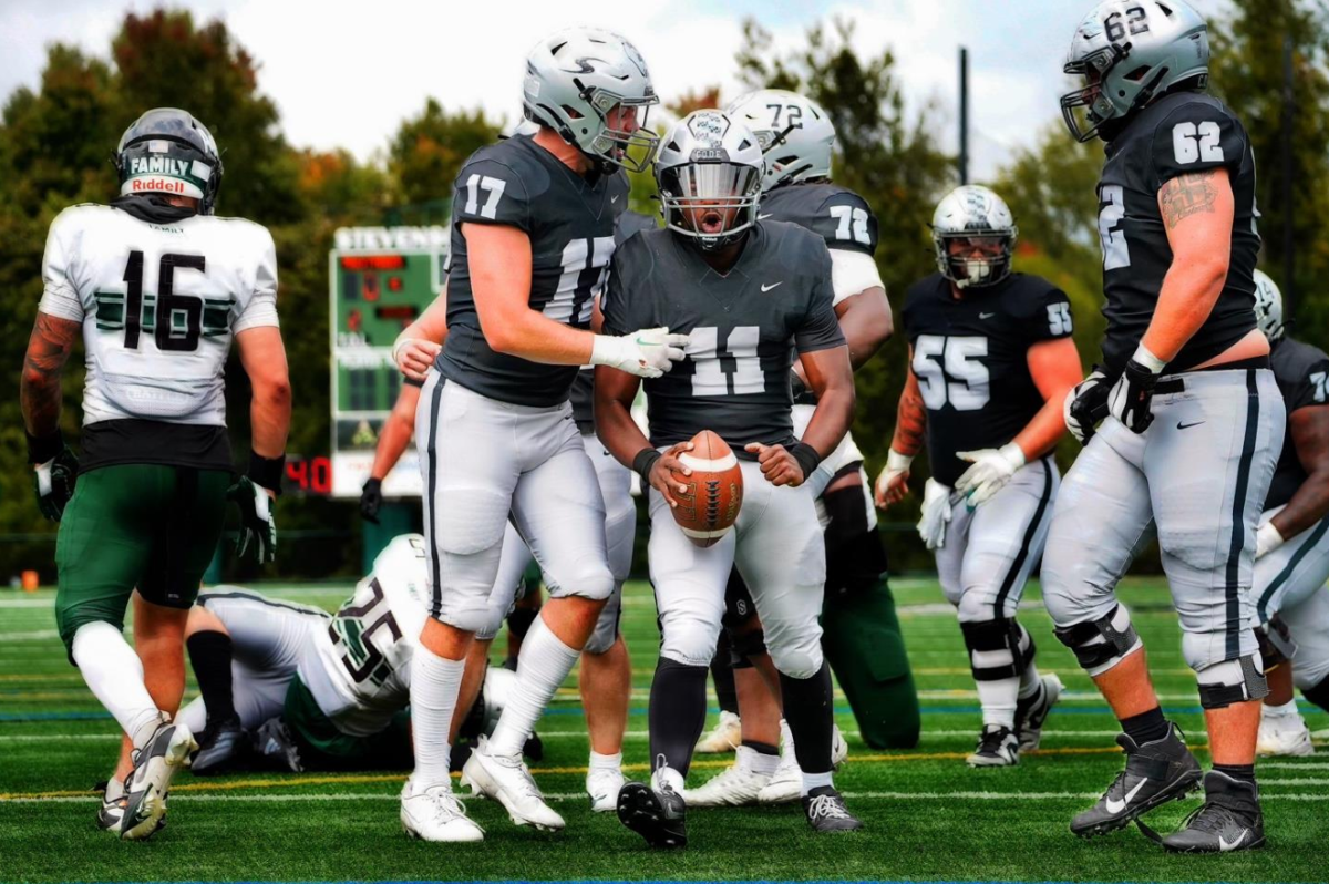 #17 Cameron Vogel and #11 Jordan Adams celebrate after Adams' two-yard touchdown run.