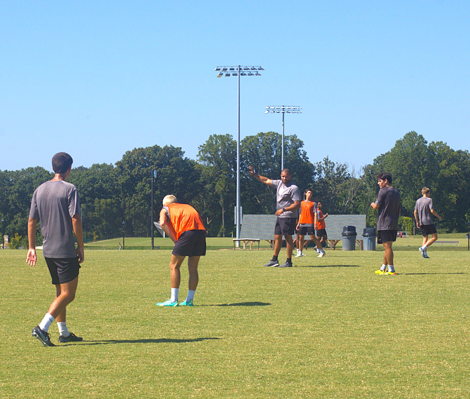 Men's soccer head coach Charlie Johnson runs a scrimmage during practice to prepare the team for their next game against Elizabethtown College this Saturday. “We have a tough schedule, so we’re gonna be tested, and once we hit the conference plays, it’s gonna get even tougher," Johnson said.