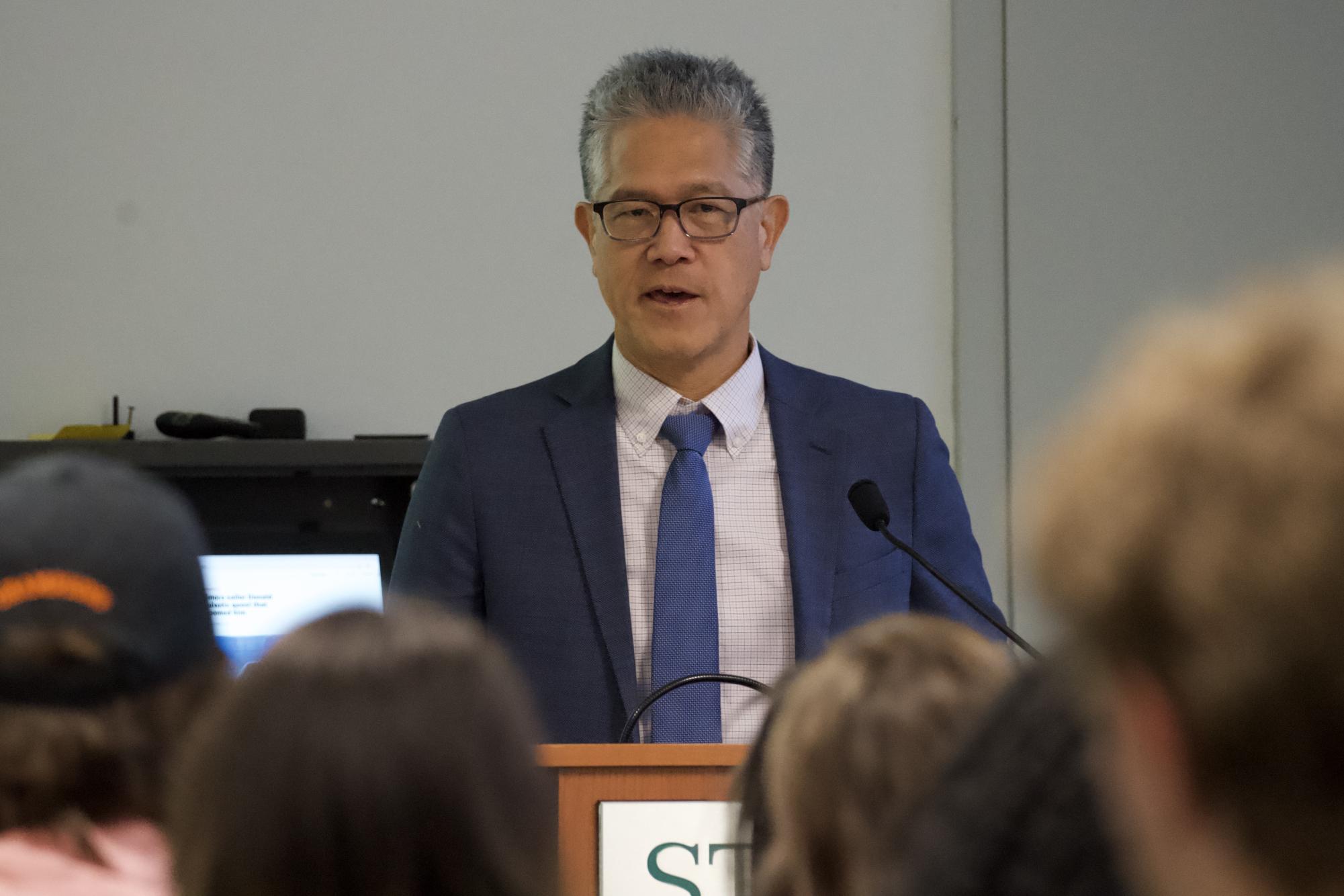 Baltimore Banner reporter Hugo Kugiya speaks to a Stevenson University audience Thursday on the value of human creativity in the age of artificial intelligence during the 16th annual Shapiro-Rouse Lecture in Garrison Hall North's Claire Moore Room.