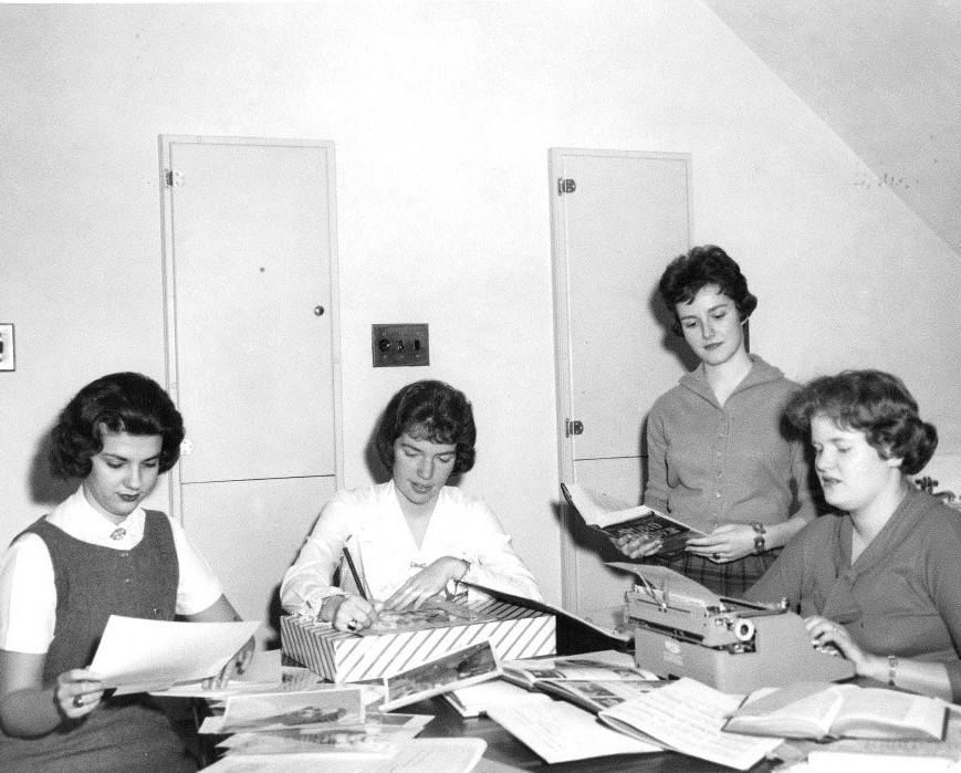 Four women work on Villa Julie College’s 1960 yearbook, known as “The Villalog.” Photograph is originally captioned “Villalog Staff - Keelty, Cooper, O’Brian, Atterogt, Pogge, & Spalding, 1960”