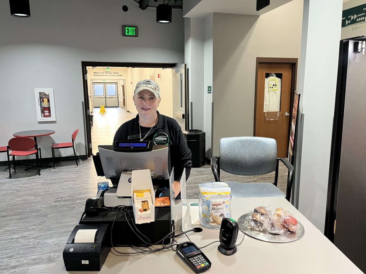 Food supervisor Shawnee Godwin offers a friendly face and helping hand to students at North Cafe.