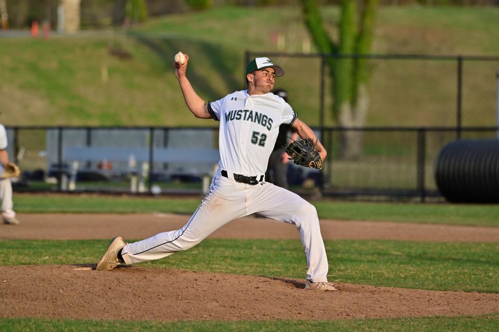 Dhruv Indelicato throwing a pitch. 