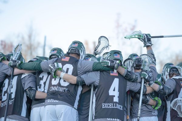 Men's lacrosse huddles during warm-ups prior to their 17-6 win against MAC opponent Hood. 