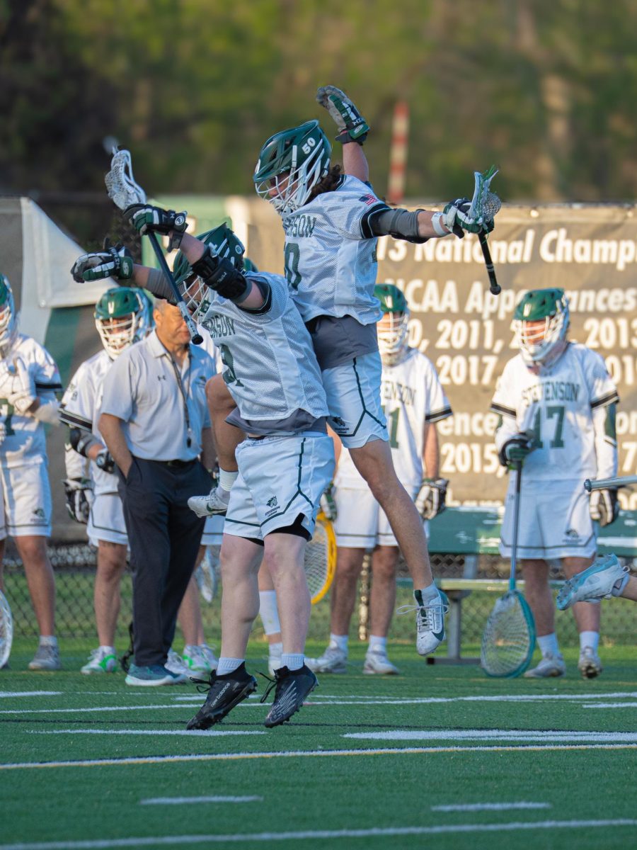 Graduate Student Jack McKenna & Senior Robbie Vanderklugt celebrate after scoring on senior night at Mustang Stadium. 